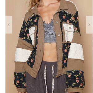 151.Jacket top in quilting with jacquard patch, front pockets, floral pattern.